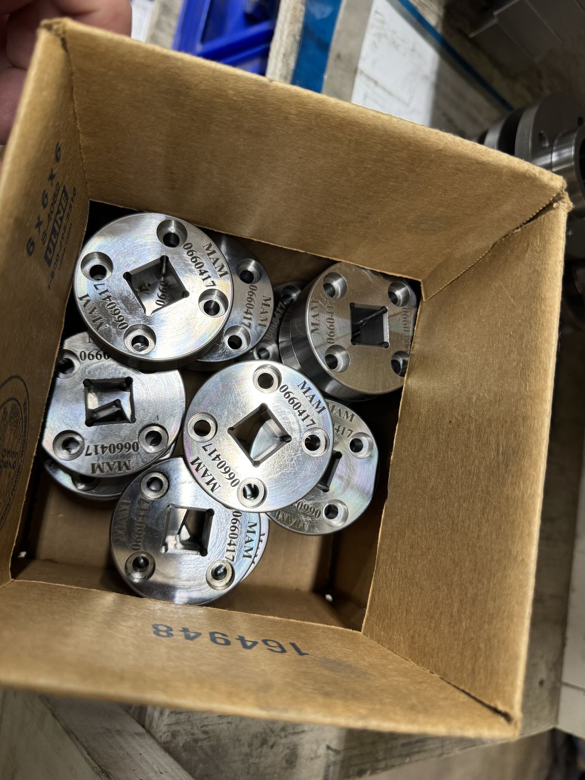 Box of MAM-branded square-broached production hubs